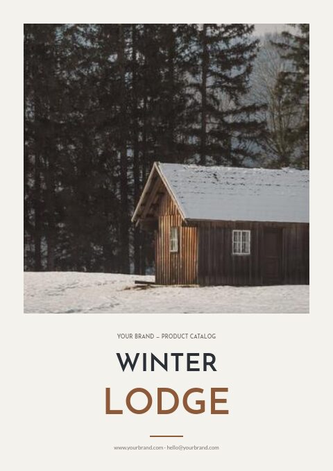 Winter catalog cover with a framed photo of a snowy wooden cabin among pines above the title Winter Lodge